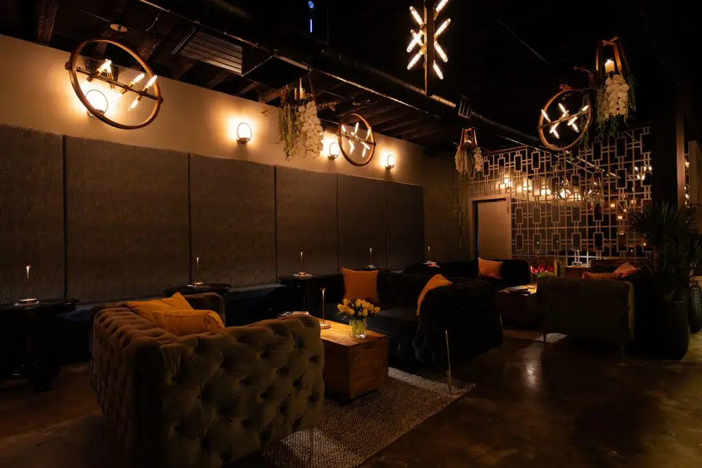 Candlelit seating in the private event space at Aye Candy